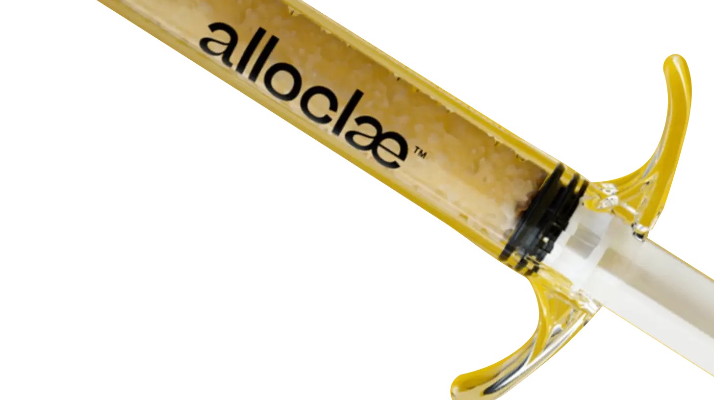 Close-up of a prefilled alloClae® container showing the ready-to-use structural adipose (fat) tissue inside