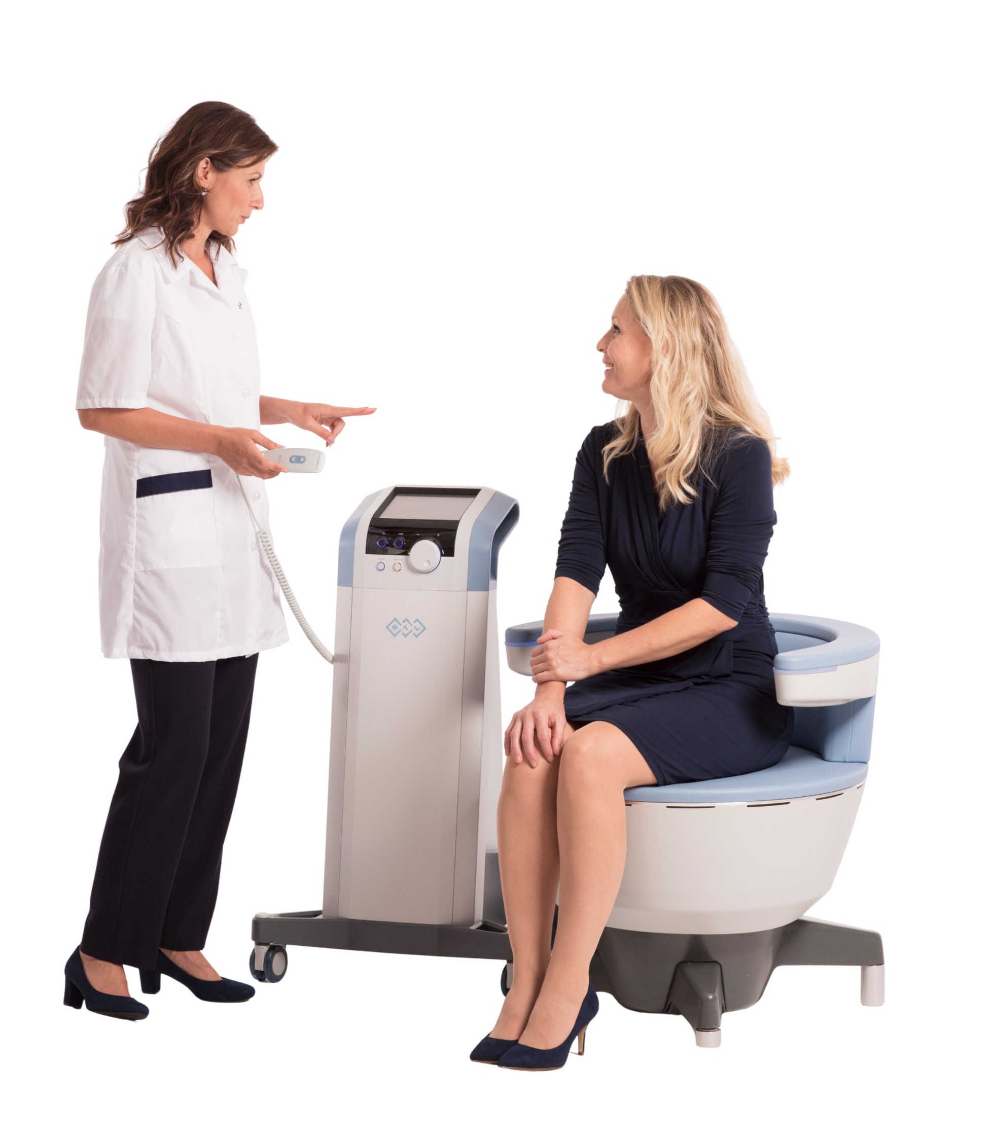 Fully clothed woman seated on the Emsella chair talking with a provider who holds the controller during a pelvic floor treatment session