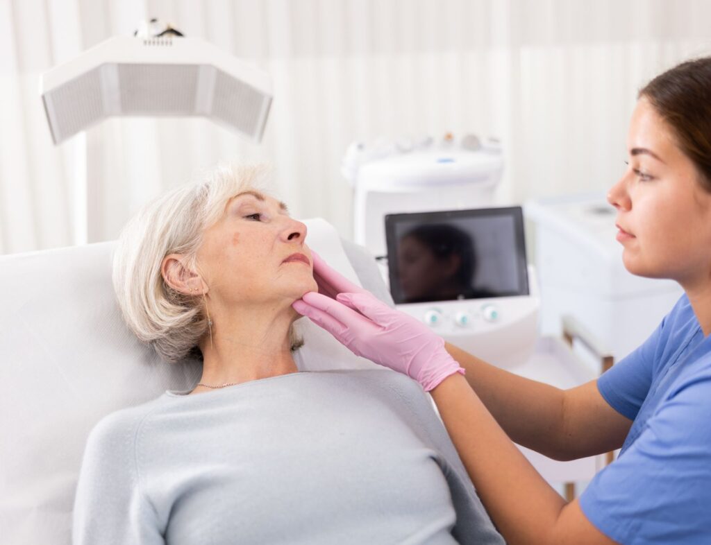 Mature woman discussing facial surgery options in a consultation